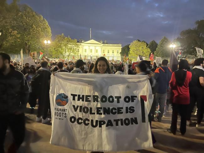 Roxana Bendezú holds a banner during a national march in Washington, DC to demand a cease fire and an end to the U.S. government's funding of genocide, on November 4, 2023. (Courtesy of Roxana Benedezú)