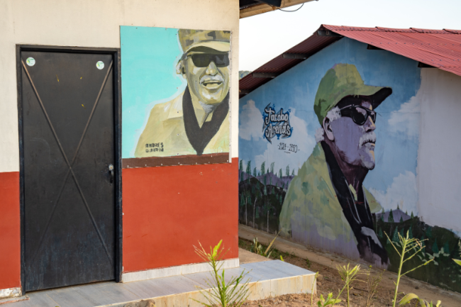 Painted portraits of the FARC’s foremost ideologue, Jacobo Arenas, on the façade of houses in Miravalle, January 2024. (Alejandro Jaramillo)