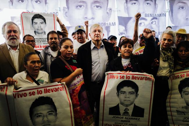 Andrés Manuel López Obrador, then president-elect, poses with the Ayotzinapa families on the fourth anniversary of the disappearances, September 26, 2018. (THIAGO DEZAN / CIDH / CC BY 2.0)
