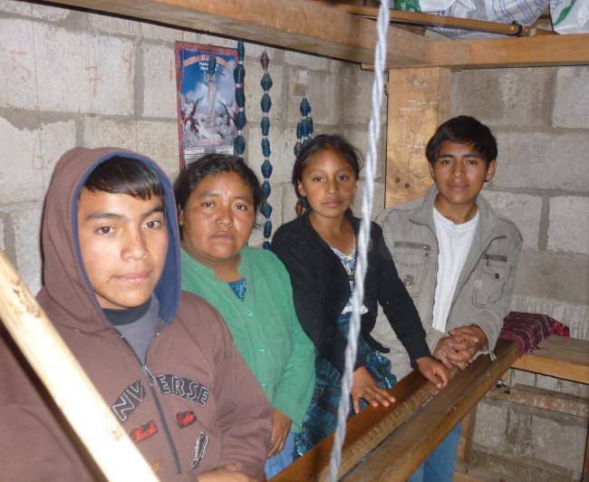 The widow and children of Jesús Caxaj in their home (Sergio Palencia)