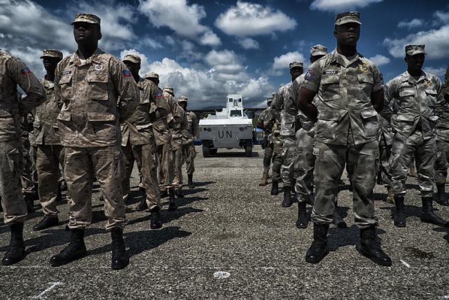 UN troops from the MINUSTAH operation that occupied Haiti for 13 years stand in formation during a 2015 ceremony in Port-au-Prince. (Logan Abassi / United Nations / CC BY-NC-ND 2.0)