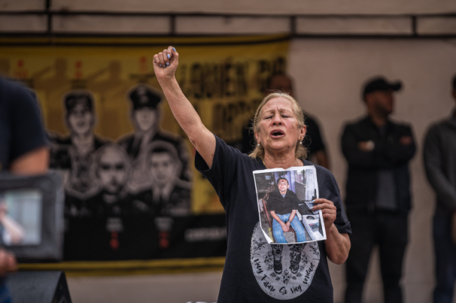 Ana Páez holds a photo of her son, Eduardo Garzón, a law student disappeared from Soacha on March 4, 2008. His body was found months later in Cimitarra, Santander. (Diego Cuevas)