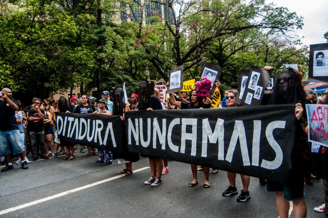 Protesters in Belo Horizonte, Brazil, commemorate victims of the dictatorship in response to President Jair Bolsonaro's suggestion that the coup be celebrated. (Midia Ninja/Flickr)