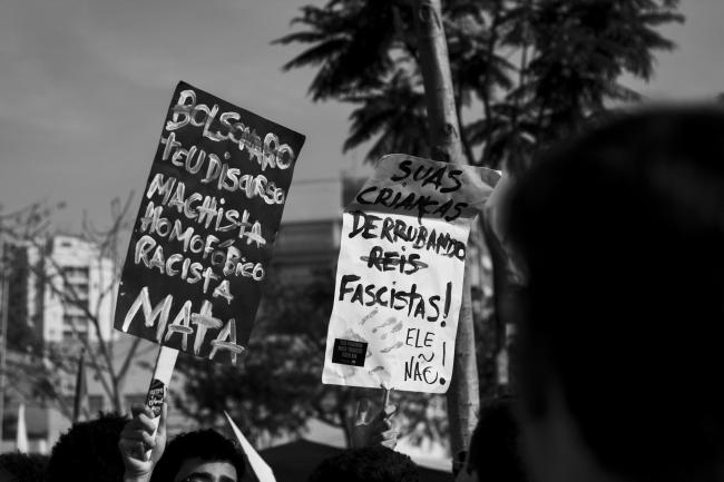 "Bolsonaro, your machista, homophobic, racist discourse kills," reads a sign protesting Jair Bolsonaro, currently leading the polls in Brazil's upcoming presidential elections (Fabio Montarroios/Flickr) 