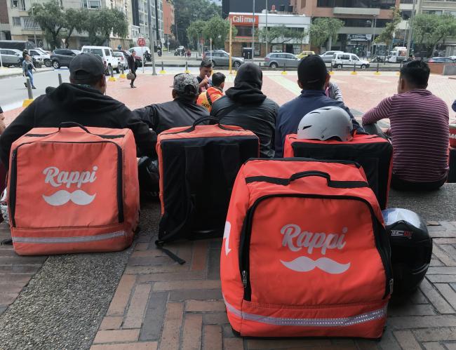 Rappi delivery workers await order requests in Bogotá, Colombia. (Photo by Carlos Felipe Pardo / Flickr)