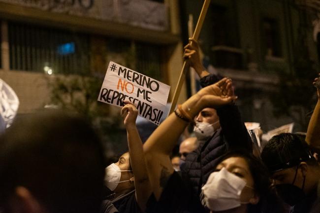 A protester holds a sign reading "Merino, you do not represent me," in Lima, November 12, 2020. (Samatha Hare / Flickr)