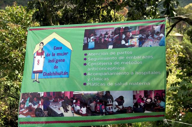 A banner from La Casa de la Mujer Indígena de Chalchihuitán outlines their services, including accompanying pregnant people to hospitals, providing childbirth care, and counseling about contraceptives and maternal health. (Flickr/PWRDF/CC BY 2.0)