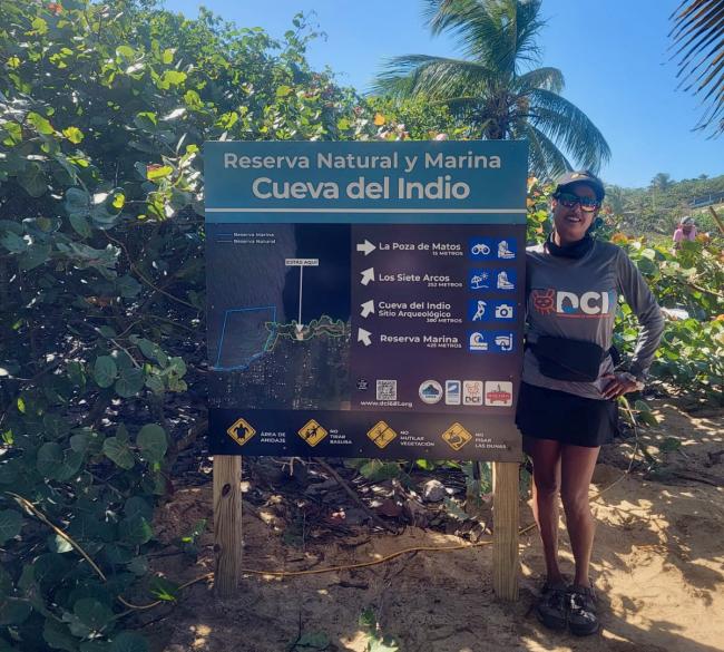 Alegna Malavé Marrero poses next to the entrance to the Cueva del Indio Nature and Marine Reserve, which has been inaccesible to the public since 2016. (Photo courtesy of (Alegna Malavé Marrero)