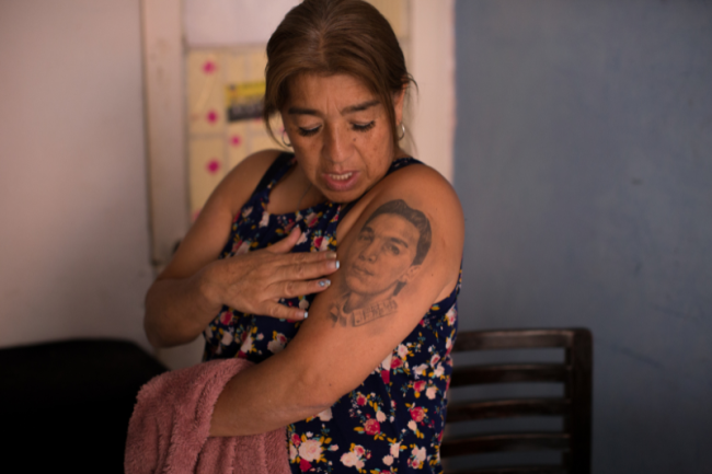 In 2016, Beatriz Méndez got a tattoo of her son Wiemar. In June 2004, the bodies of Weimar and his cousin Edward were found shot dead and dressed in military fatigues in Ciudad Bolívar in the south of Bogotá. (Andrés Torres Galeano)