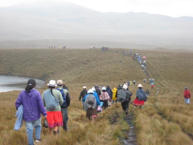 Local residents walk through the Kimsacocha paramo, the site of a long-disputed gold mining project that would damage the fragile ecosystem and watershed. A provincial court suspended the project last month. (Teresa Velásquez)