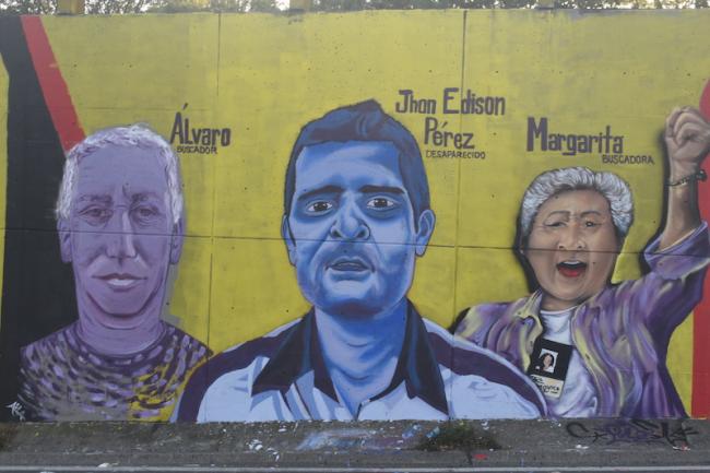 Mural featuring a portrait of Margarita Restrepo, whose daughter went missing in Comuna 13 in 2002, among others disappeared by state violence. (Joshua Collins)