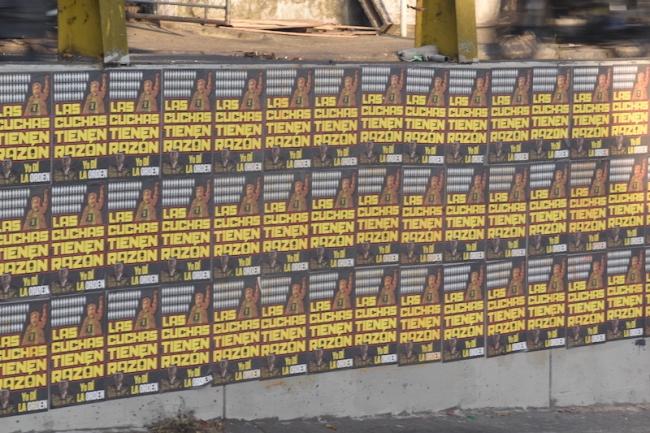 Posters that read "las cuchas tenían la razón" (the old ladies were right), which refers to mothers of missing children's insistence that authorities investigate La Escombrera. (Joshua Collins)