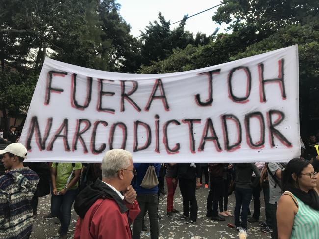 “Out with JOH, narcodictator” Demonstrators protest election fraud and the fatal crackdown on anti-fraud protests in Tegucigalpa, days after electoral authorities declared Juan Orlando Hernández the elections winner. December 20, 2017. (Heather Gies)