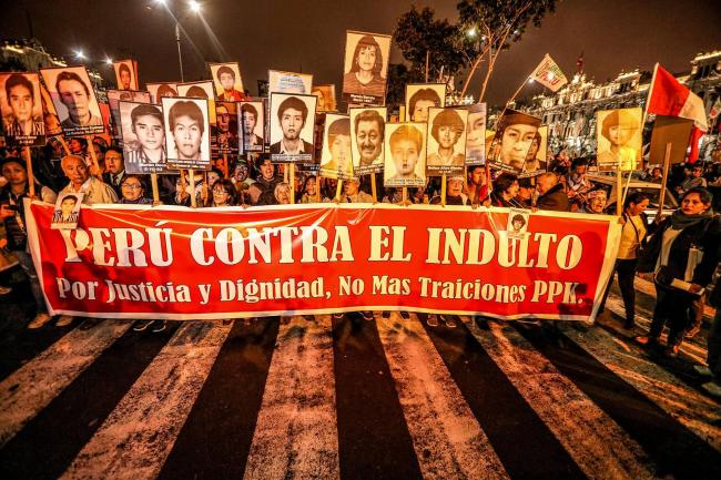 Peruvians took to the streets on December 28, days after President Pedro Pablo Kuczynski (PPK) announced a humanitarian pardon for Alberto Fujimori, convicted of grave violations of human rights - Peru Against the Pardon, for Justice, Dignity, No More Betrayals PPK - the sign reads (Photo by Walter Hupiu Tapia) 