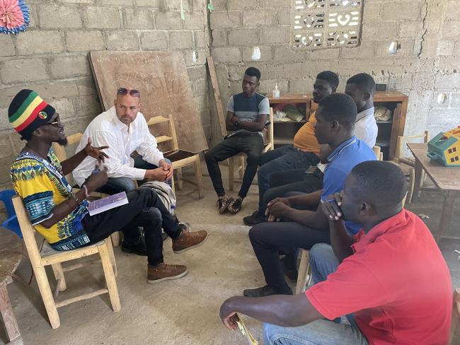 Co-author Danny Shaw accompanies Domine Resain in a community meeting with leaders in Okap. (Danny Shaw)