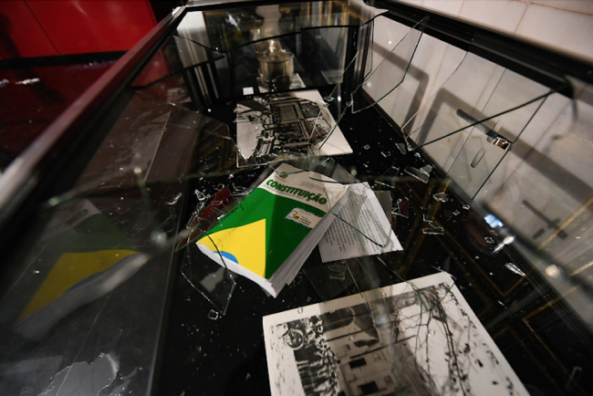 Brazil's constitution sits beneath broken glass in the National Congress after the attack by Bolsonaro supporters, January 8, 2023. (Jefferson Rudy / Agência Senado / CC BY 2.0)