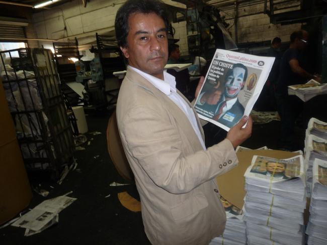 Javier Castaño holds up a print edition of Queens Latino. (Photo courtesy of Javier Castaño)