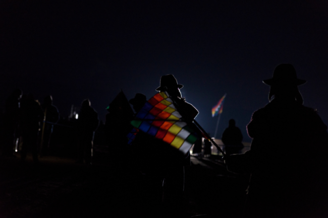 Indigenous supporters of Evo Morales attend a dawn ceremony at the pre-Columbian sacred site of Tiwanaku, January 21, 2016. (Marcelo Pérez del Carpio)