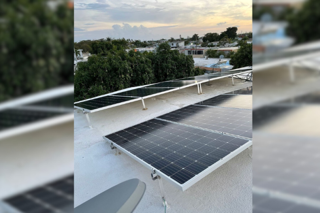 An image of rooftop solar installation in Puerto Rico. In Puerto Rico, there is a huge disparity between those who can afford rooftop solar and battery systems sold by major U.S. corporations, and the majority of residents who cannot (Ruth Santiago)