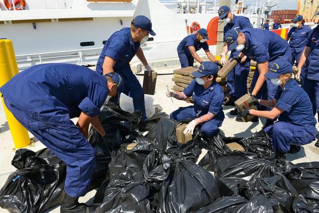 The U.S. Coast Guard offloads seized cocaine in Miami Beach, 2014 (Photo by Sabrina Laberdesque/Wikimedia) 