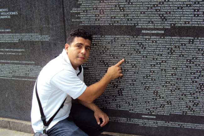 Nelson/Roberto points to his birth name on the Monument to Memory and Truth in San Salvador, 2011. (Mireya Lara)