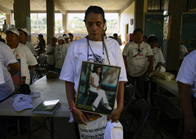 Priscila Rodríguez Cartagena, from Honduras, holds a picture of her daughter, Yesenia Marleni Gaitan Cartagena, who disappeared in disappeared in 2008, when she was 19. (Photo by Federico Barahona) 