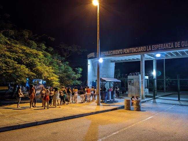 Women and children line up before dawn to visit loved ones at La Esperanza prison in Guaduas, Colombia, October 15, 2023. (Joseph Hiller)