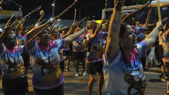 Members of the Paraíso do Tuiuti samba school parade during a Carnival rehearsal in Rio de Janeiro on February 10, 2025. (Constance Malleret)