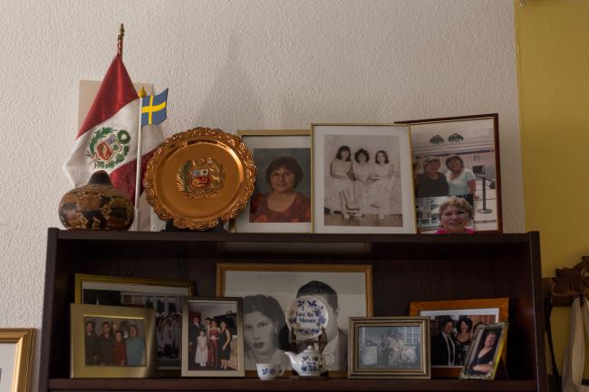 In her apartment in Sweden, Martin keeps framed photographs of memories both in Peru and Sweden. (Photo by Beatriz Sokol)