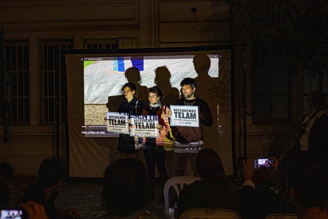 Directors and producer María Alché, Bárbara Francisco Mendivil, and Benjamín Naishtat expressed solidarity with Télam employees by screening their 2023 film “Puan” on the street in front of the protest camp. Buenos Aires. April 9, 2024. (Daniel Cholakian)