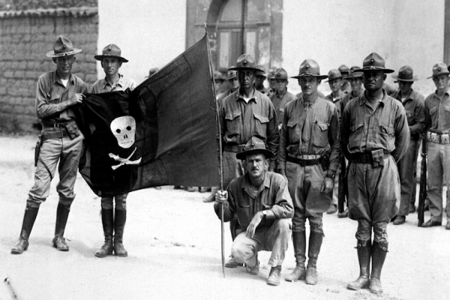 U.S. Marines hold Sandino's flag, Nicaragua, 1932. (U.S. Marine Corps)