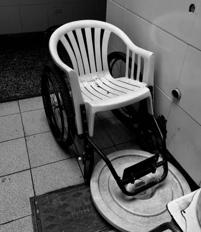 A bathroom and makeshift wheelchair at the Canevaro Shelter in Lima. (Magdalena Zegarra Chiappori)