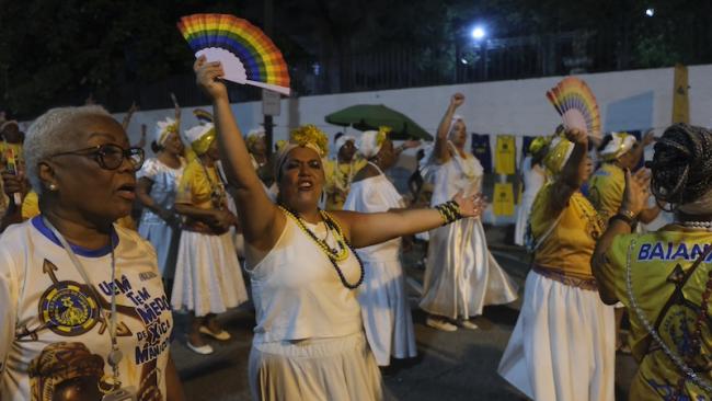 Women in the “baianas” wing parade during Paraíso do Tuiuti’s Carnival rehearsal in Rio de Janeiro on February 10, 2025. Each samba school has a “baianas” wing celebrating Afro-Brazilian matriarchs. (Constance Malleret)