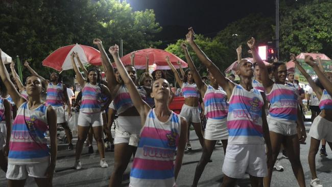 Performers in Paraíso do Tuiuti’s opening ensemble dance during a rehearsal of the samba school’s Carnival parade in Rio de Janeiro on February 10, 2025. Half of the group is made up of trans women, which is unprecedented. (Constance Malleret)