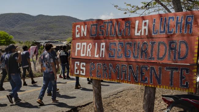 At Xayakalan's community-organized security checkpoint, a sign reads, "En Ostula la lucha por la seguridad es permanente" (In Ostula, the struggle for security is permanent." (Regina López)