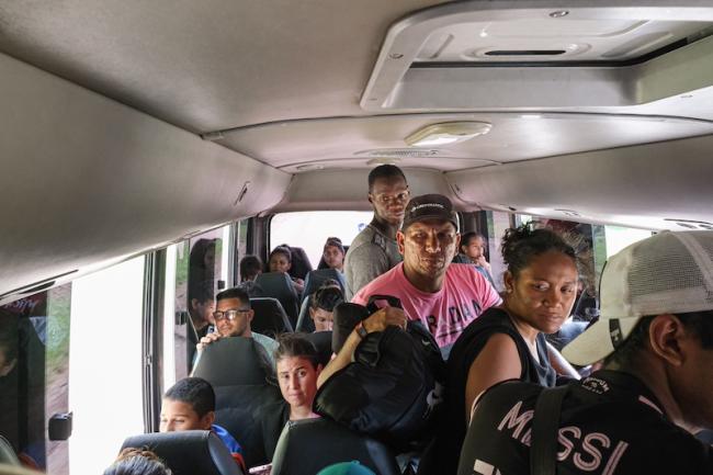 People on the move leaving a humanitarian center in Danlí, Honduras, headed for Guatamala on a 12-hour bus journey. (Timothy O'Farrell)