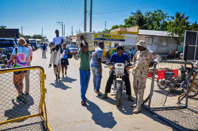 An agent of the Dominican Republic's Specialized Border Security Corps (CESFRONT) stands at the border with Haiti in Dajabon, July 15, 2011. (Sandra Foyt / Shutterstock)