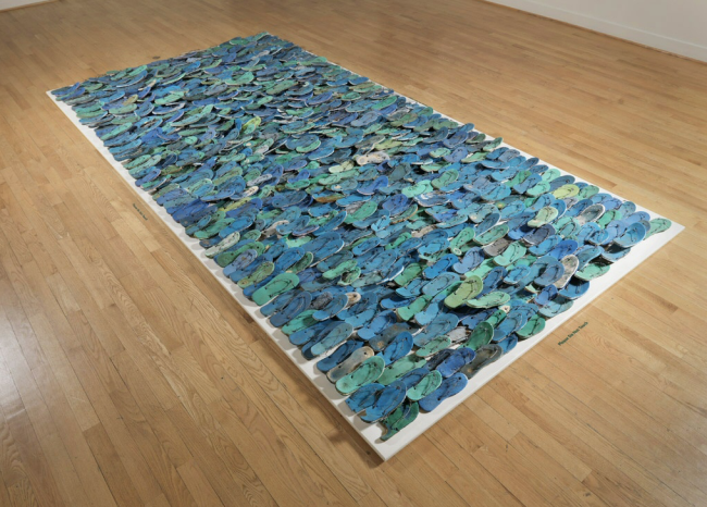 Tony Capellán, Mar Caribe. Plastic, rubber, and barbed wire, 360 × 228 in. © Tony Capellán. Courtesy of Tony Capellán estate. Photo of installation view courtesy of the Museum of Art, Rhode Island School of Design, Providence.