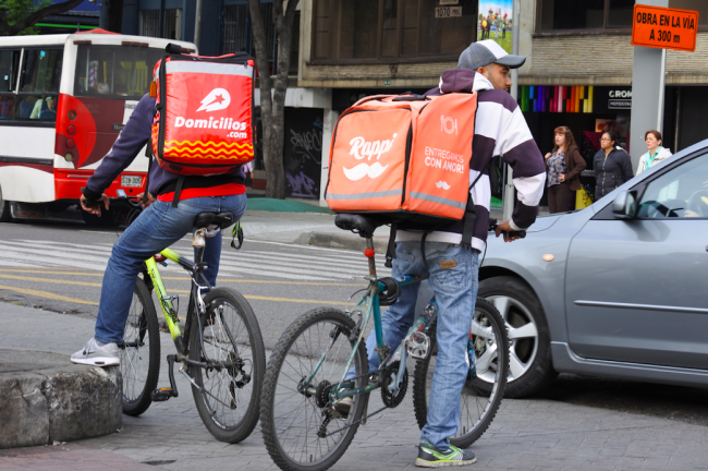 Delivery works on the job in Bogotá, Colombia, 2019. (Carlos Felipe Pardo / CC BY 2.0)
