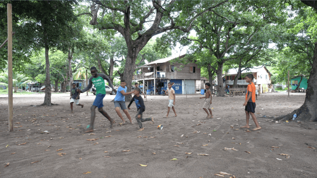 Children playing in Crawfish Rock, Honduras, where a ZEDE charter city is forming. (Dassaev Aguilar)